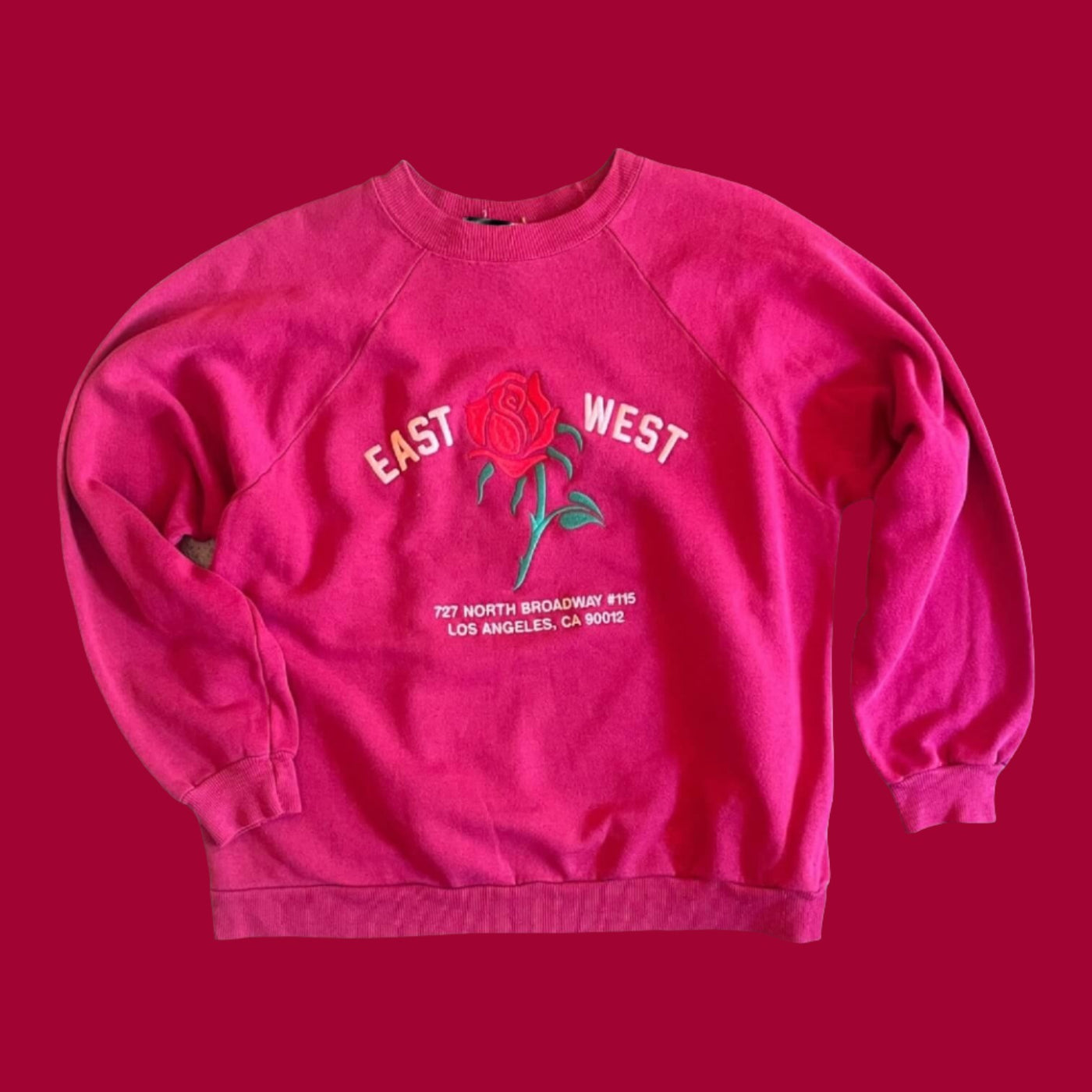 Vintage Sweatshirt with raglan sleeves.  Embroidered with Rose and reads “East West 727 N. Broadway #115, Los Angeles, CA 90012”