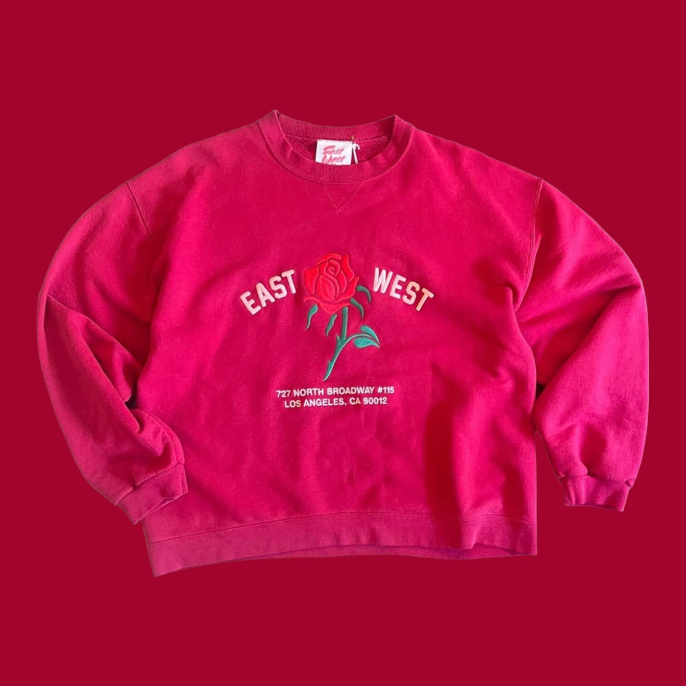 Vintage Sweatshirt with set in sleeves.  Embroidered with Rose and reads “East West 727 N. Broadway #115, Los Angeles, CA 90012”