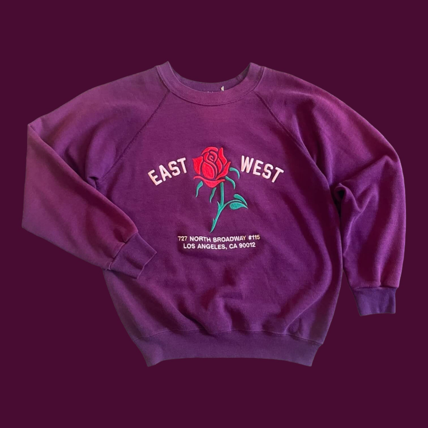 Vintage Sweatshirt with raglan sleeves.  Embroidered with Rose and reads “East West 727 N. Broadway #115, Los Angeles, CA 90012”