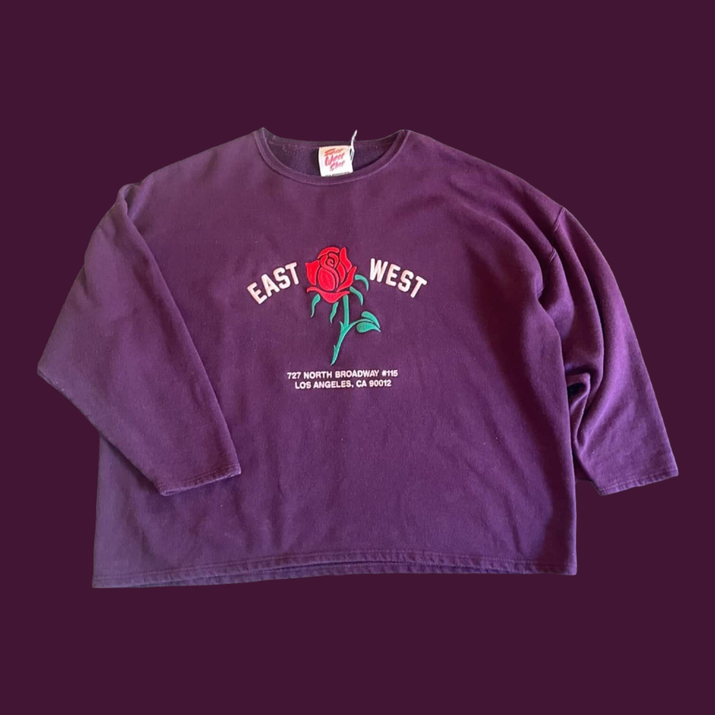 Vintage Sweatshirt with set in sleeves.  Embroidered with Rose and reads “East West 727 N. Broadway #115, Los Angeles, CA 90012”